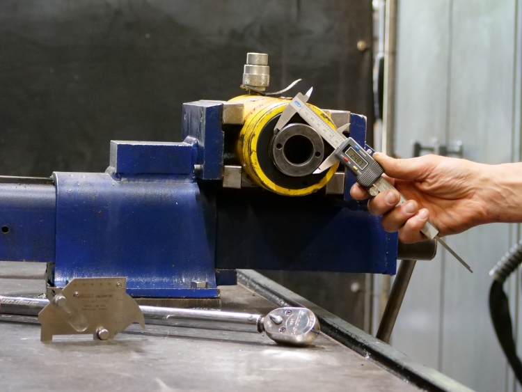 man measuring cylinder